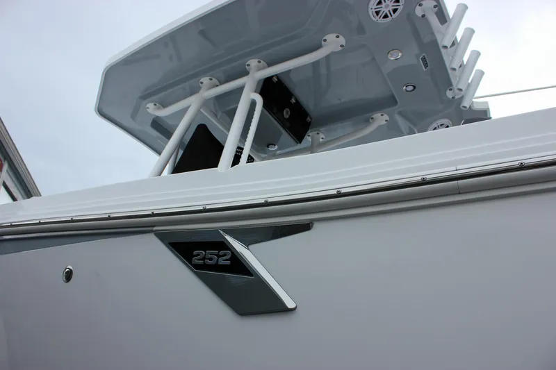 Irish Eyes Yacht Photos Pics 2023 Blackfin 252 CC boat, close-up of sleek design and logo.