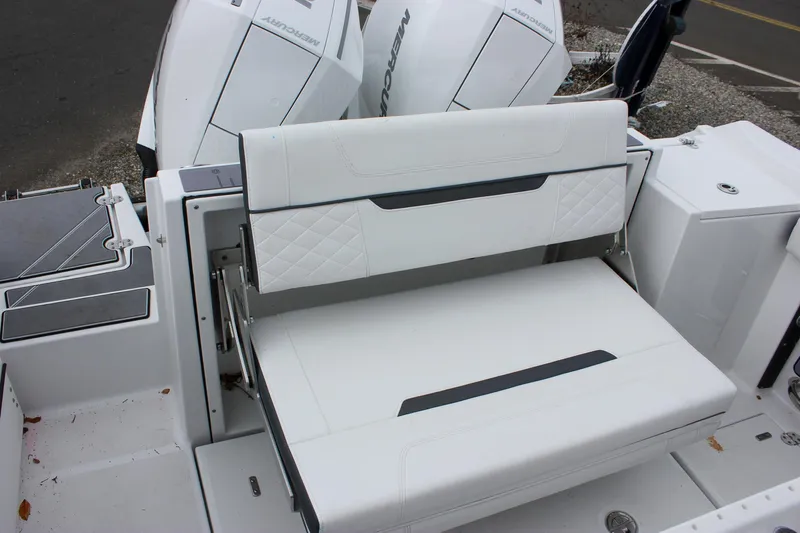 Irish Eyes Yacht Photos Pics 2023 Blackfin 252 CC boat with white cushioned seating and dual outboard motors.
