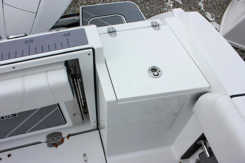 Irish Eyes Yacht Photos Pics 2023 Blackfin 252 CC boat deck with storage compartment and seating.