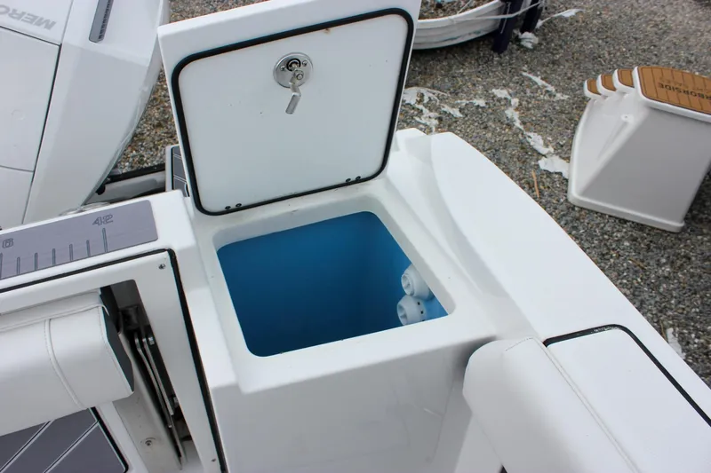 Irish Eyes Yacht Photos Pics Open storage compartment on 2023 Blackfin 252 CC boat, featuring a secure lockable lid.