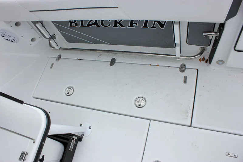 Irish Eyes Yacht Photos Pics 2023 Blackfin 252 CC boat deck with storage compartments and seating area.