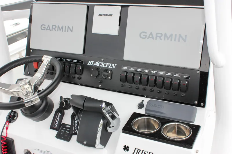 Irish Eyes Yacht Photos Pics 2023 Blackfin 252 CC boat dashboard with Garmin displays and Mercury controls.