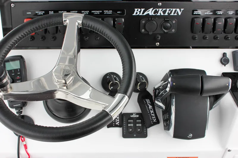 Irish Eyes Yacht Photos Pics 2023 Blackfin 252 CC boat dashboard with steering wheel and control panel.