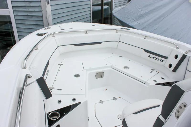 Irish Eyes Yacht Photos Pics 2023 Blackfin 252 CC boat interior with white seating and storage compartments.