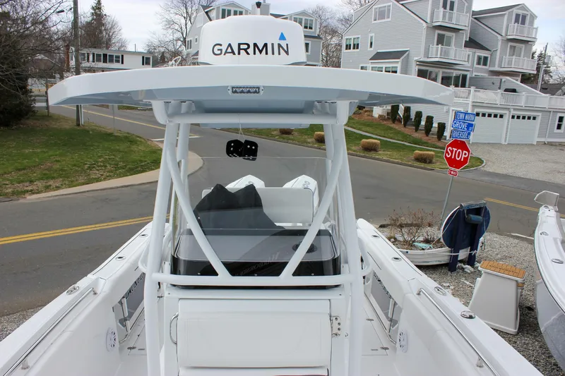 Irish Eyes Yacht Photos Pics 2023 Blackfin 252 CC boat with Garmin equipment, docked near residential area.