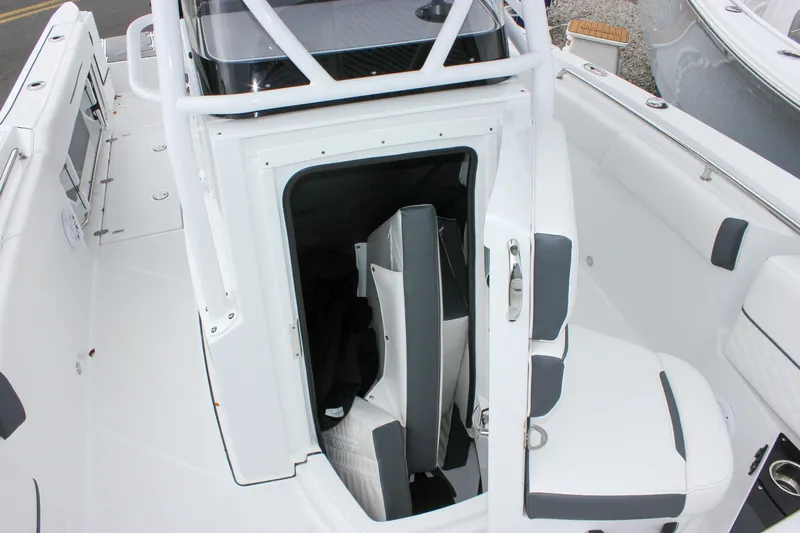 Irish Eyes Yacht Photos Pics 2023 Blackfin 252 CC boat interior with seating and storage area.