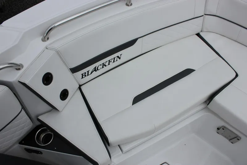 Irish Eyes Yacht Photos Pics 2023 Blackfin 252 CC boat interior seating with sleek white and black design.