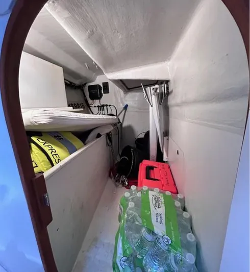 Sundog Yacht Photos Pics Storage area inside a 2006 J Boats J/124, featuring supplies and equipment.