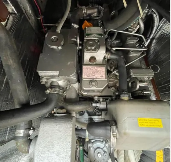 Sundog Yacht Photos Pics Engine compartment of a 2006 J Boats J/124 sailboat, showcasing mechanical components.