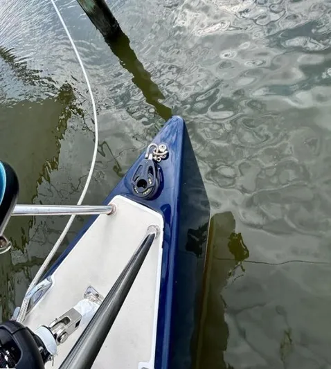 Sundog Yacht Photos Pics Bow of 2006 J Boats J/124 sailboat on calm water.