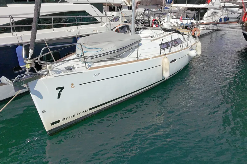  Yacht Photos Pics 2013 Beneteau Oceanis 370 sailboat docked in marina, side view.