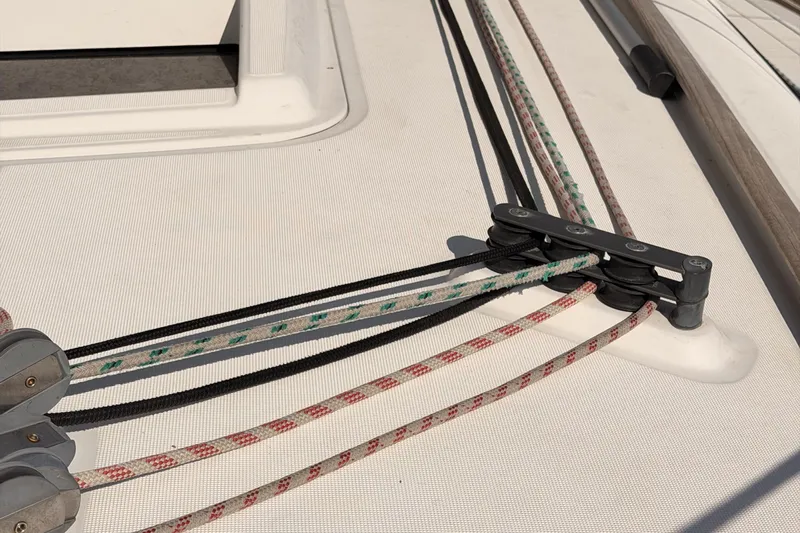  Yacht Photos Pics Deck of 2013 Beneteau Oceanis 370 sailboat with colorful ropes and cleats.