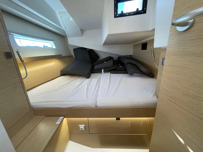 In Stock Yacht Photos Pics 2024 Hanse 410 yacht cabin with modern design and comfortable bedding.