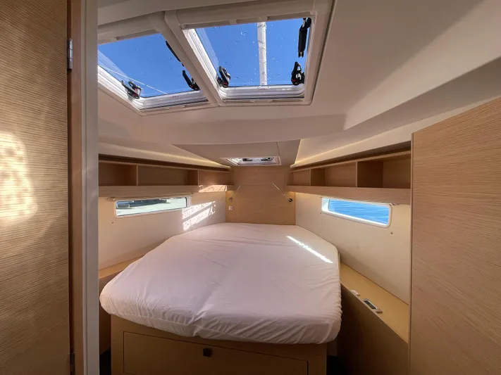 In Stock Yacht Photos Pics Luxurious cabin interior of 2024 Hanse 410 yacht with skylights and modern design.
