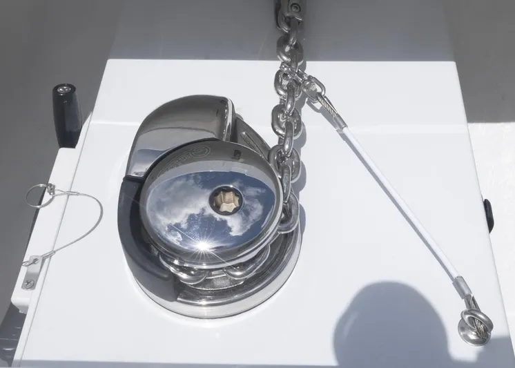  Yacht Photos Pics Anchor windlass on 2026 Invincible 33 Catamaran, reflecting sky and clouds.