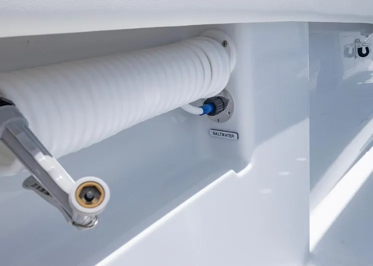  Yacht Photos Pics Saltwater hose connection on 2026 Invincible 33 Catamaran, featuring coiled white hose.