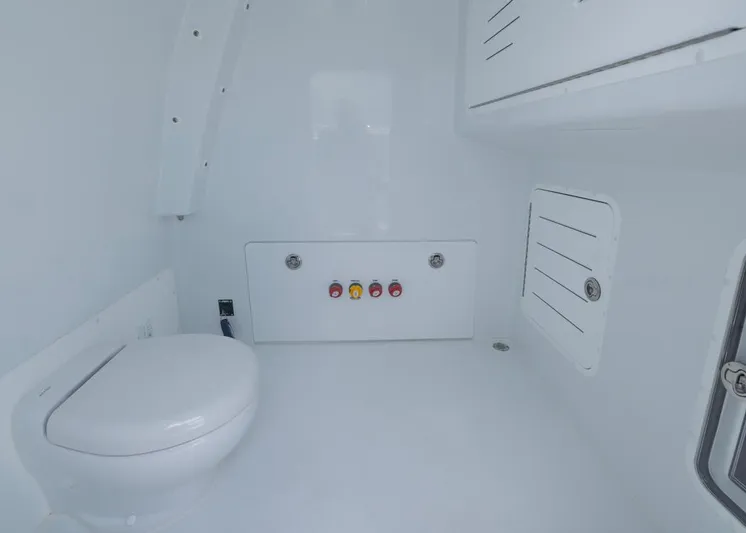  Yacht Photos Pics Interior of 2026 Invincible 33 Catamaran bathroom with modern fixtures and storage compartments.