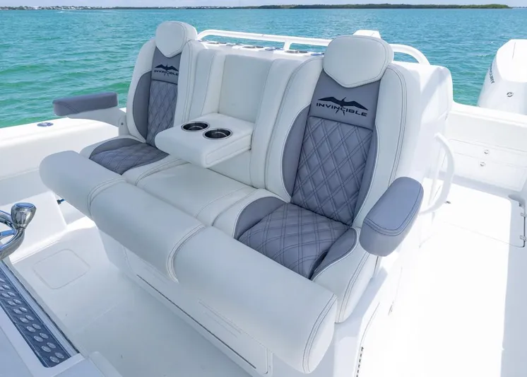  Yacht Photos Pics Luxury seating on 2026 Invincible 33 Catamaran with ocean backdrop.