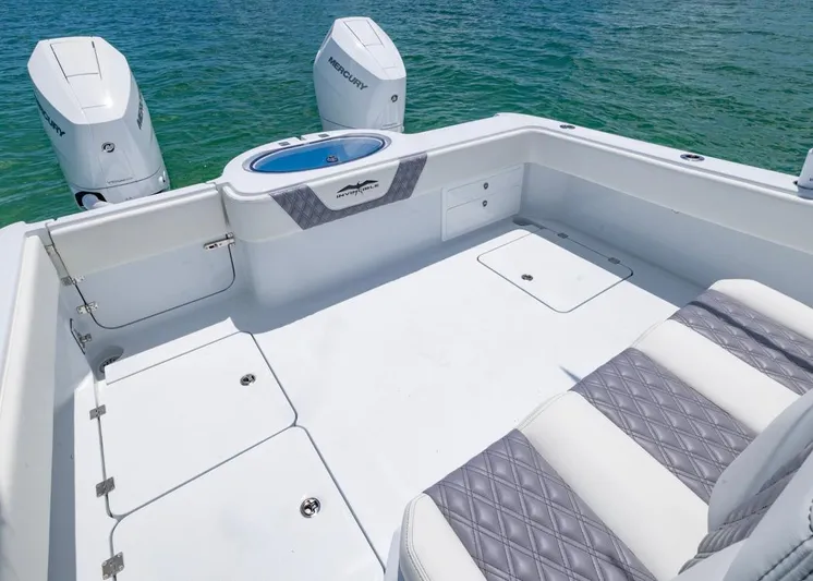  Yacht Photos Pics 2026 Invincible 33 Catamaran with Mercury engines, featuring spacious deck and seating.