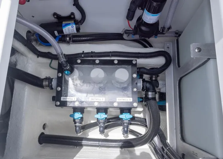  Yacht Photos Pics Baitwell system in 2026 Invincible 33 Catamaran, showcasing plumbing and valves.