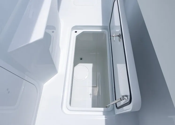  Yacht Photos Pics Open storage compartment on 2026 Invincible 33 Catamaran, showcasing sleek design and functionality.