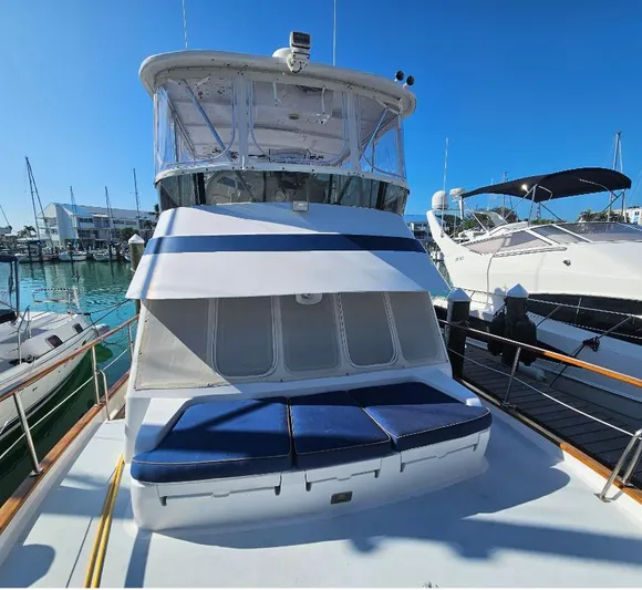 Southern Cross Yacht Photos Pics 1987 Tayana 45 Expedition Trawler docked, featuring blue cushions and a clear sky backdrop.