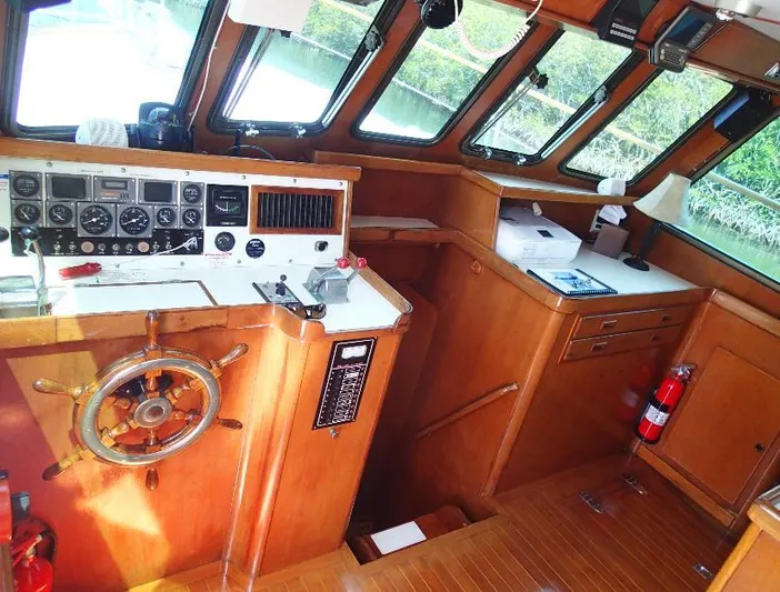 Southern Cross Yacht Photos Pics 1987 Tayana 45 Expedition Trawler helm with wooden interior and navigation instruments.