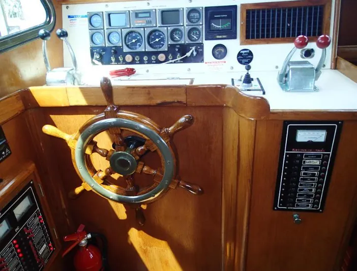 Southern Cross Yacht Photos Pics 1987 Tayana 45 Expedition Trawler helm with wooden wheel and control panel.