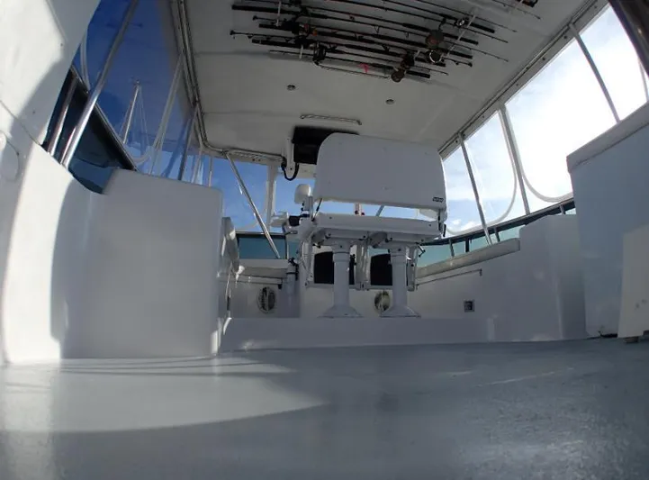 Southern Cross Yacht Photos Pics Interior view of 1987 Tayana 45 Expedition Trawler with fishing rods on ceiling.