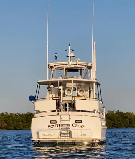 Southern Cross Yacht Photos Pics 1987 Tayana 45 Expedition Trawler on water, rear view, "Southern Cross" name visible.