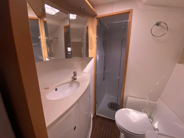  Yacht Photos Pics Bathroom interior of 2009 Lagoon 440 yacht with shower, sink, and toilet.