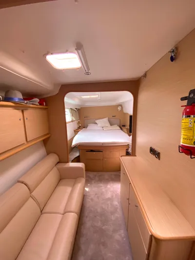  Yacht Photos Pics Interior of 2009 Lagoon 440 catamaran with cozy cabin and beige furnishings.