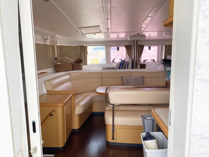  Yacht Photos Pics Interior of 2009 Lagoon 440 yacht with beige seating and wooden accents.