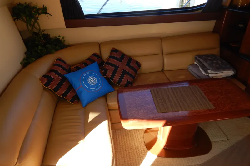 Odyssey Yacht Photos Pics Luxurious interior of 2008 Meridian 411 Sedan with leather seating and decorative cushions.