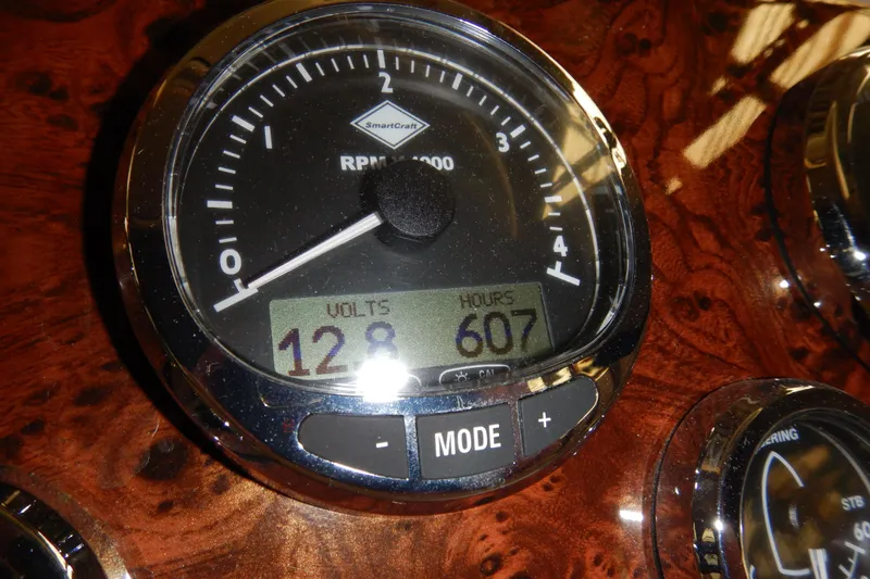 Odyssey Yacht Photos Pics Close-up of a SmartCraft gauge on a 2008 Meridian 411 Sedan boat dashboard.