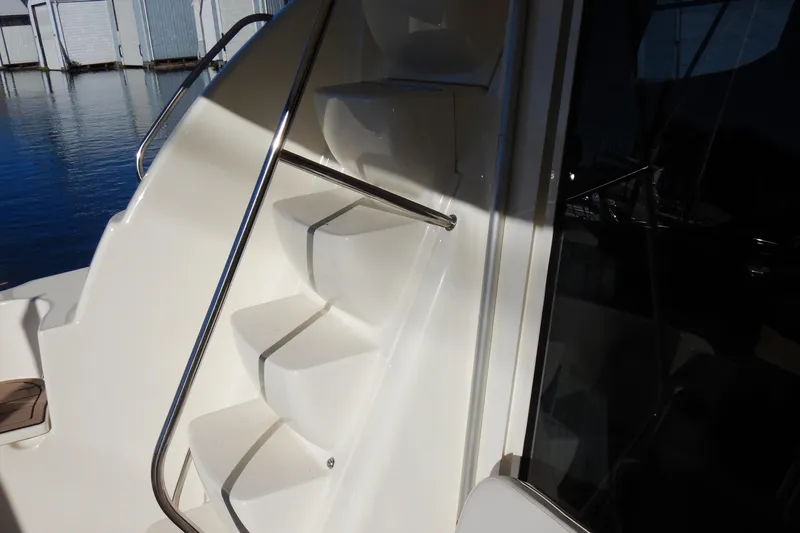 Odyssey Yacht Photos Pics Staircase on 2008 Meridian 411 Sedan yacht with stainless steel railing.