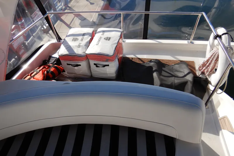Odyssey Yacht Photos Pics 2008 Meridian 411 Sedan boat deck with life jackets and safety equipment.