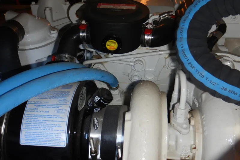 Odyssey Yacht Photos Pics Engine components of a 2008 Meridian 411 Sedan, featuring hoses and mechanical parts.