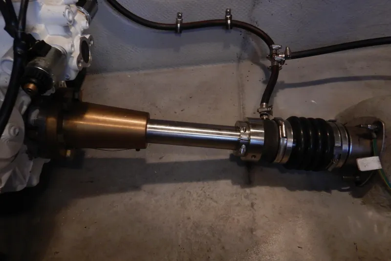 Odyssey Yacht Photos Pics 2008 Meridian 411 Sedan engine component with metal shaft and hoses.