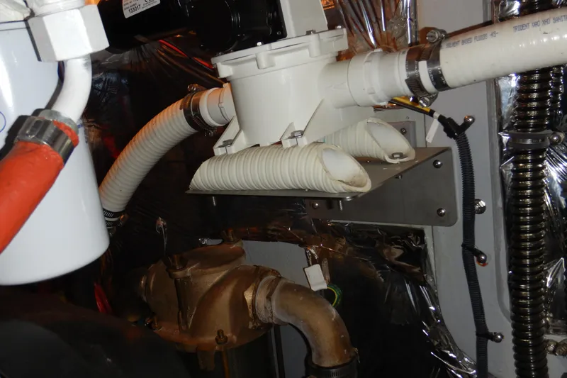 Odyssey Yacht Photos Pics Engine room of 2008 Meridian 411 Sedan with hoses and mechanical components.