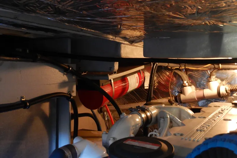 Odyssey Yacht Photos Pics Engine room of 2008 Meridian 411 Sedan with visible fire extinguisher and mechanical components.