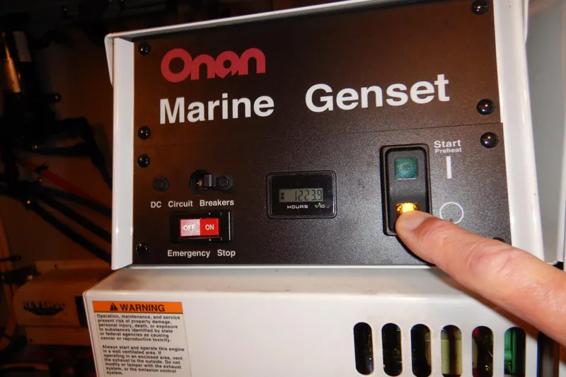 Odyssey Yacht Photos Pics Onan Marine Genset control panel with start button on a 2008 Meridian 411 Sedan.