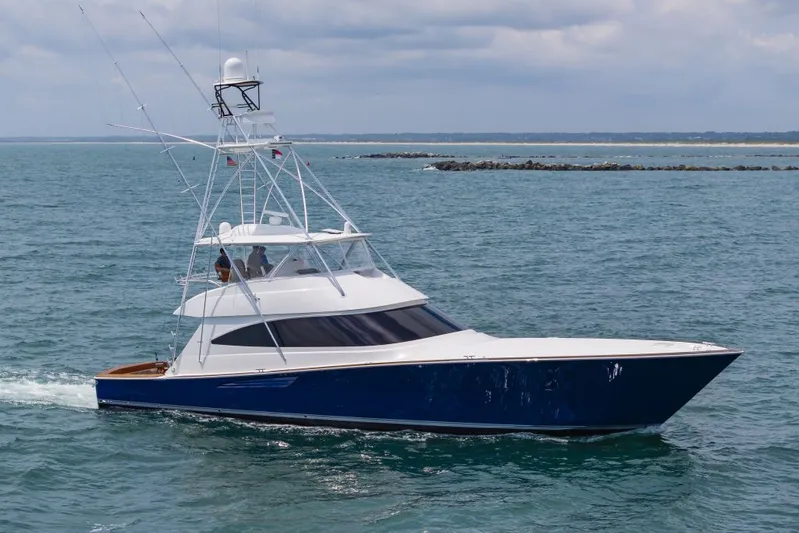 Safari Yacht Photos Pics 2022 Viking 72 Convertible yacht cruising on open water.