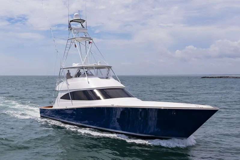 Safari Yacht Photos Pics 2022 Viking 72 Convertible yacht cruising on open water.