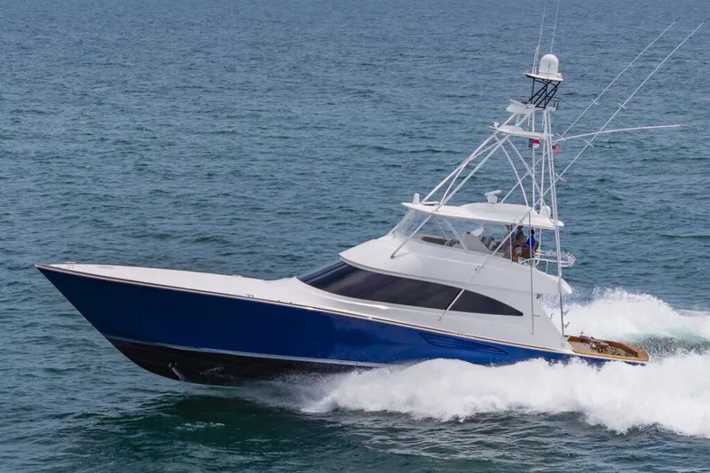 Safari Yacht Photos Pics 2022 Viking 72 Convertible yacht cruising on open water.