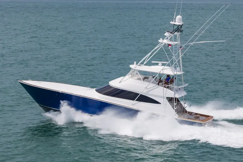 Safari Yacht Photos Pics 2022 Viking 72 Convertible yacht cruising on open water.