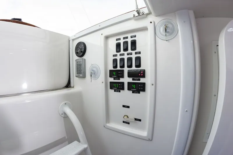 Safari Yacht Photos Pics Control panel of 2022 Viking 72 Convertible yacht, featuring switches and gauges.
