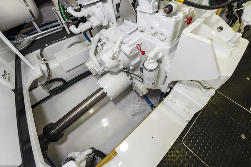Safari Yacht Photos Pics Engine room of 2022 Viking 72 Convertible yacht, showcasing mechanical components and systems.