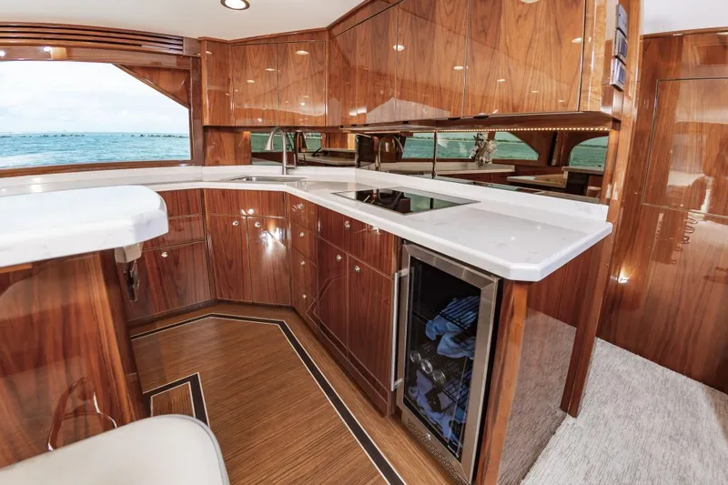 Safari Yacht Photos Pics Luxurious kitchen interior of 2022 Viking 72 Convertible yacht with ocean view.