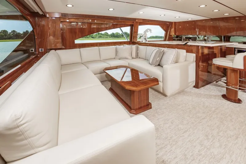 Safari Yacht Photos Pics Luxurious interior of 2022 Viking 72 Convertible yacht with elegant seating and wooden accents.